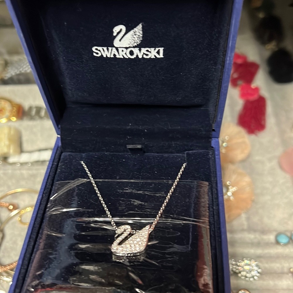Swarovski floating swan necklace. New. Never used.